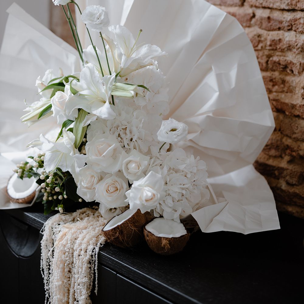 White Lilies, hydrangeas and roses wedding flower and fan arrangement 