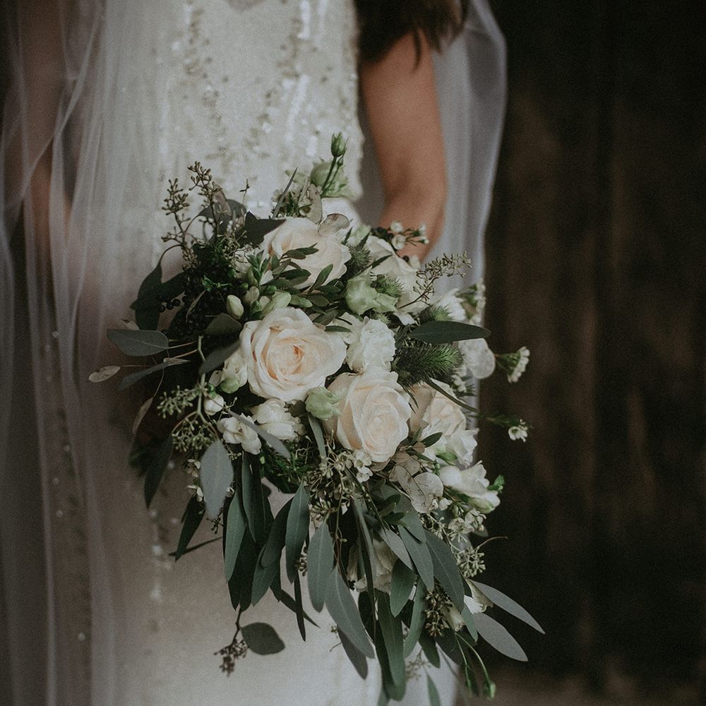 White floral bouquet with green foliage 