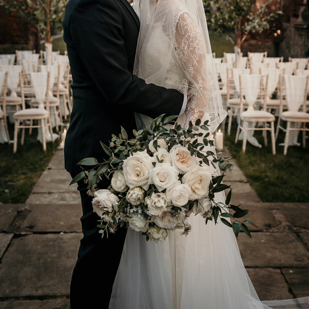 Groom kissing his brides forehead at the bombed out church in Liverpool 
