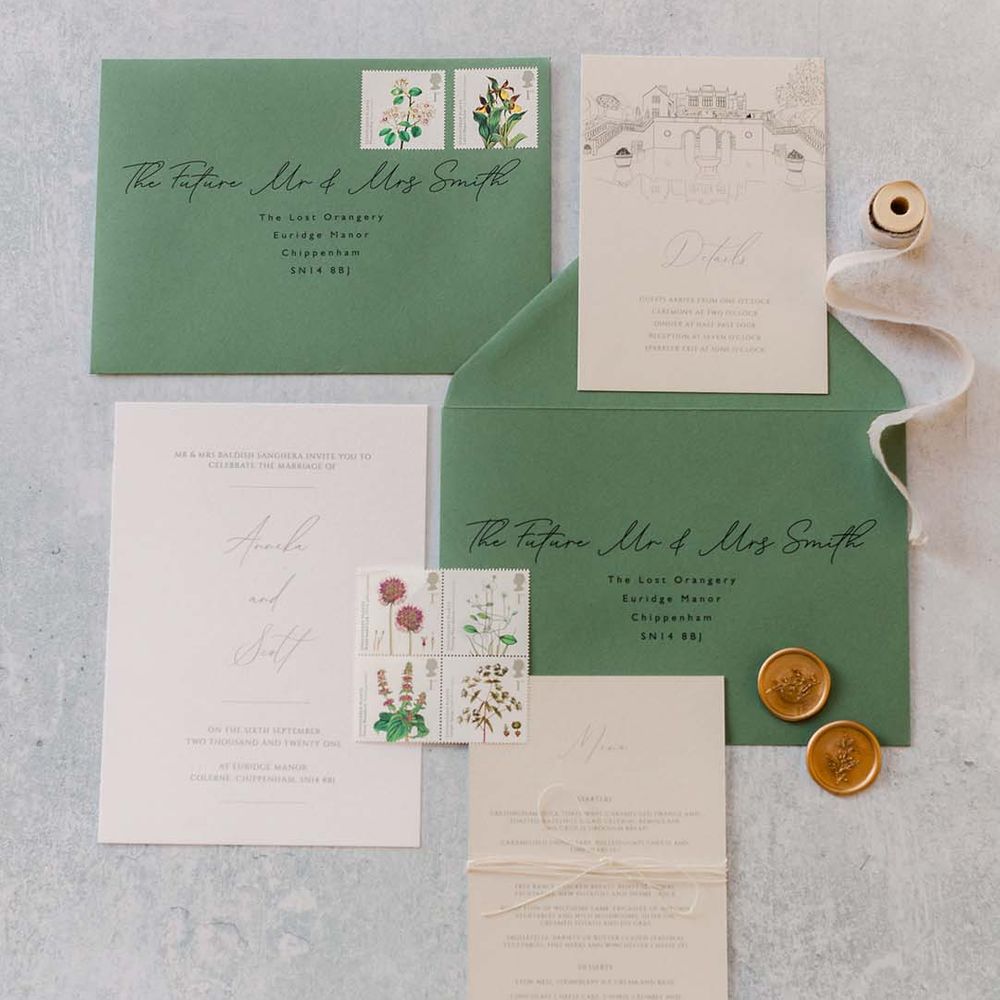 Classic pastel wedding stationery in pale green and creams with a French antique style 