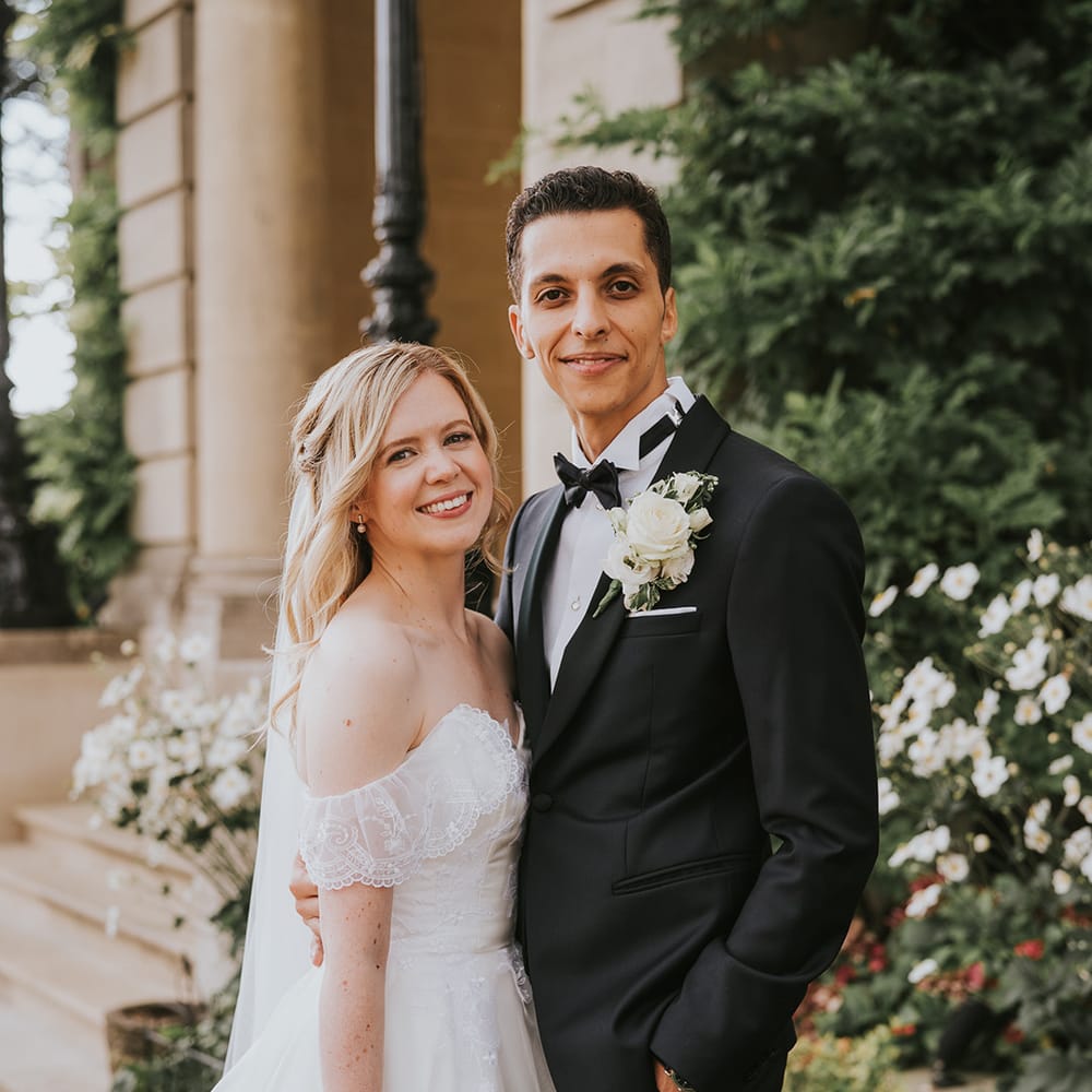 bride in ballgown wedding dress posing with groom in black tie for classic wedding 