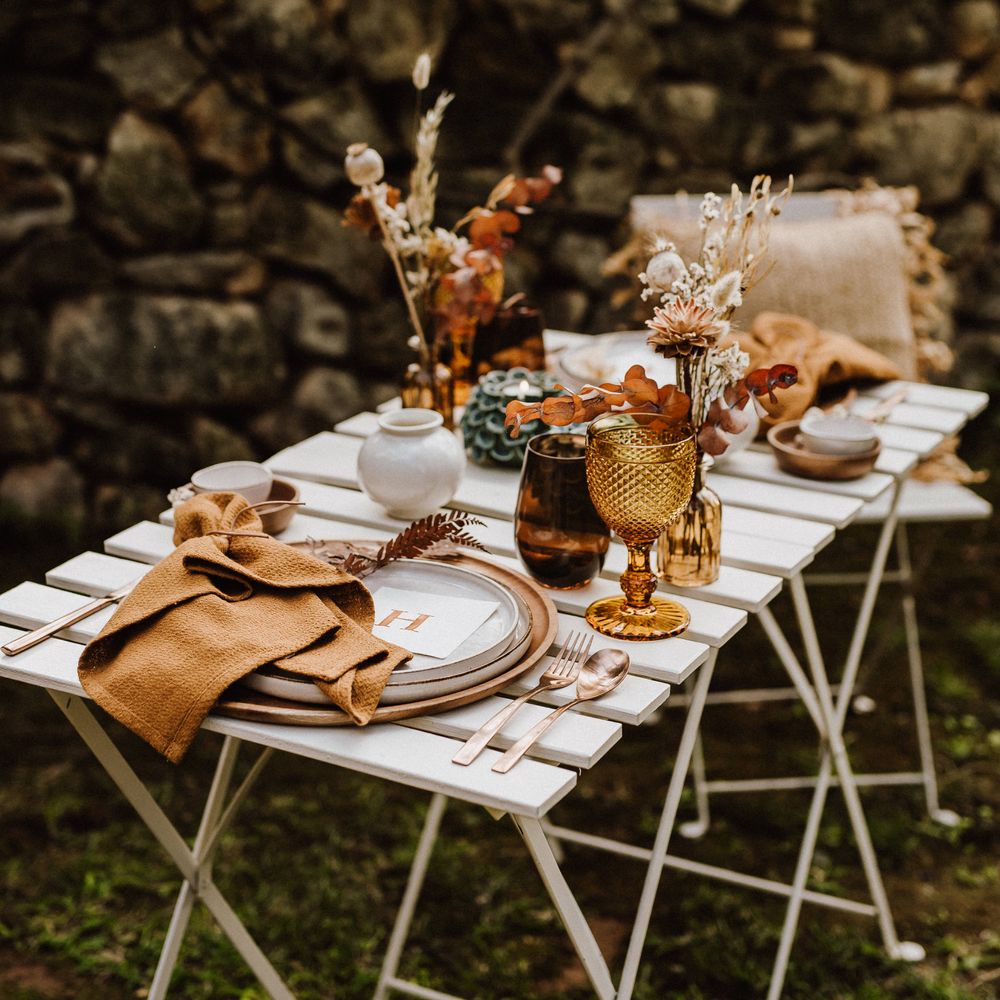 Rustic table setting with brass knives and forks