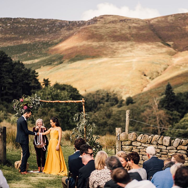 Bride & groom during wedding ceremony outdoors
