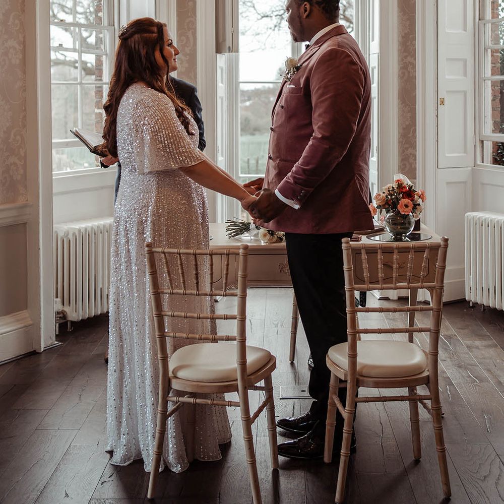 Bride & groom look lovingly at one another during ceremony 