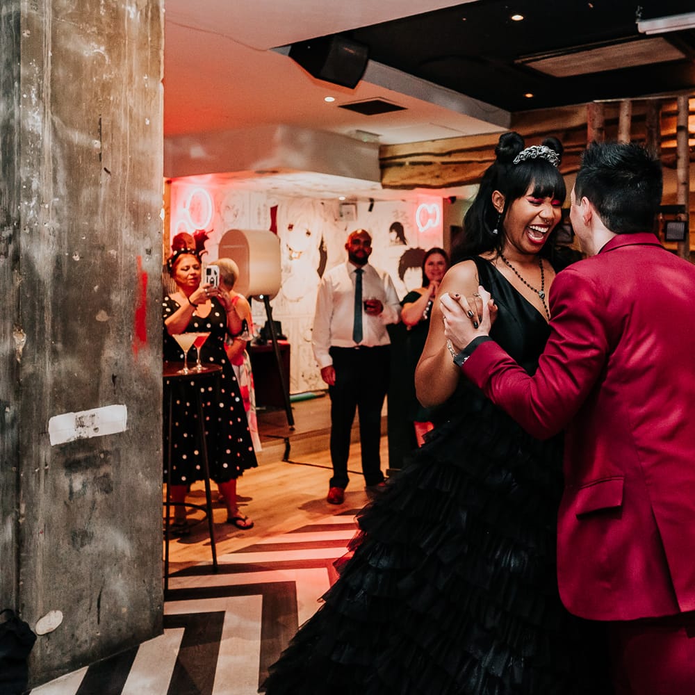 Bride & groom have their first dance during untraditional wedding reception  