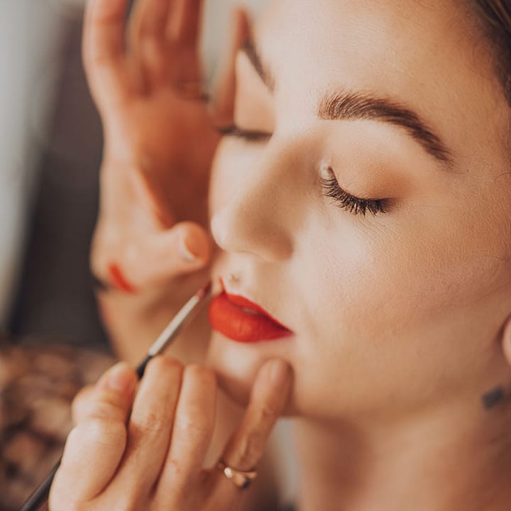 Bride wears bright red lipstick on her wedding day
