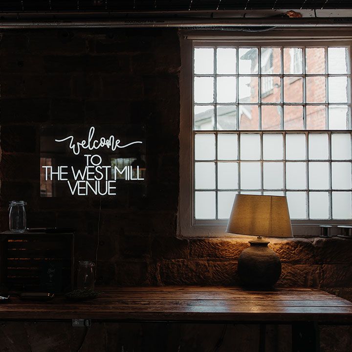 White neon wedding sign for The West Mill industrial venue 