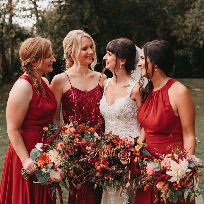 Bridal party portrait with bridesmaids in rust dresses at Millbridge Court wedding