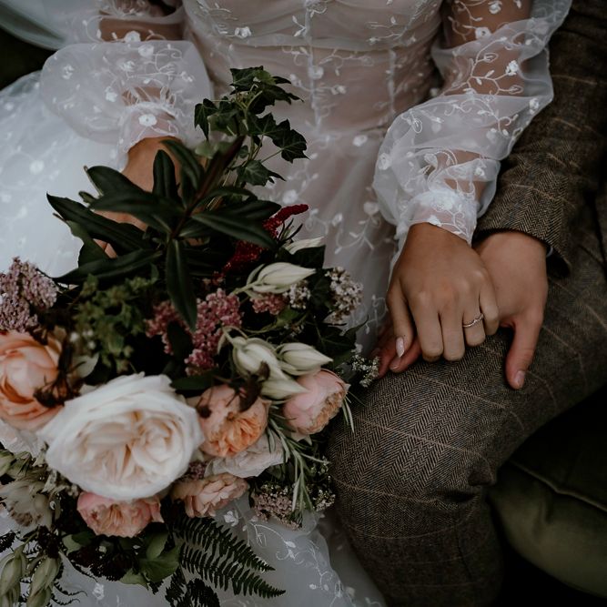 Bride and groom holding hands at Sherwood Glade woodland wedding