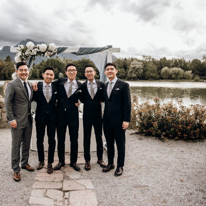 Groomsmen portrait in black and grey wedding suits 