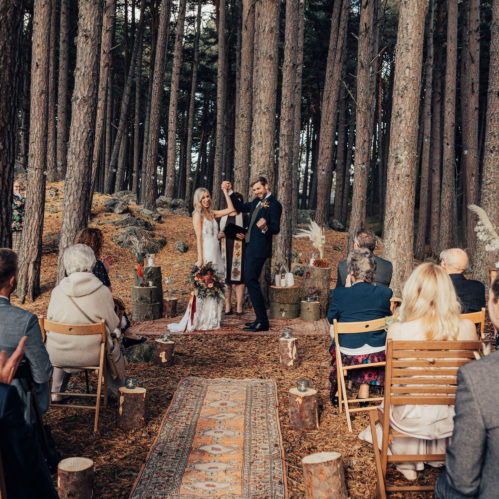 Bride & groom in woodland ceremony celebrate after marriage