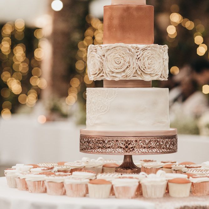 White and blush wedding cake with Lace detail, ruffle design and flower cake topper 