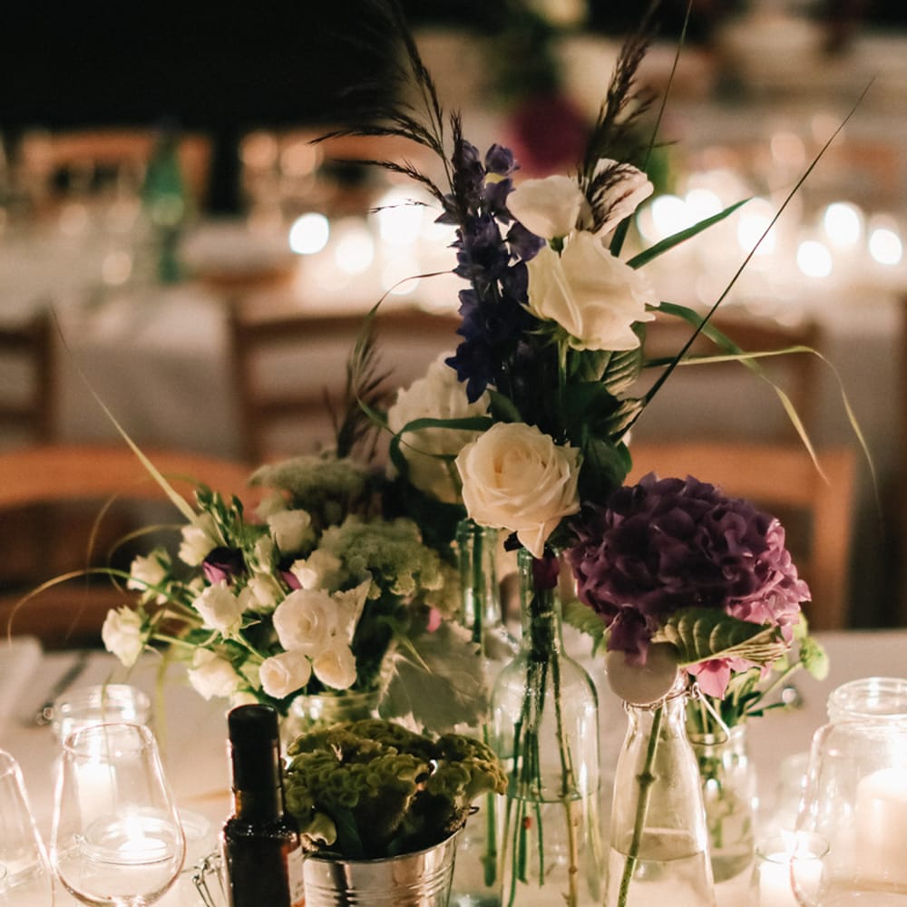 Purple and white wedding table flowers