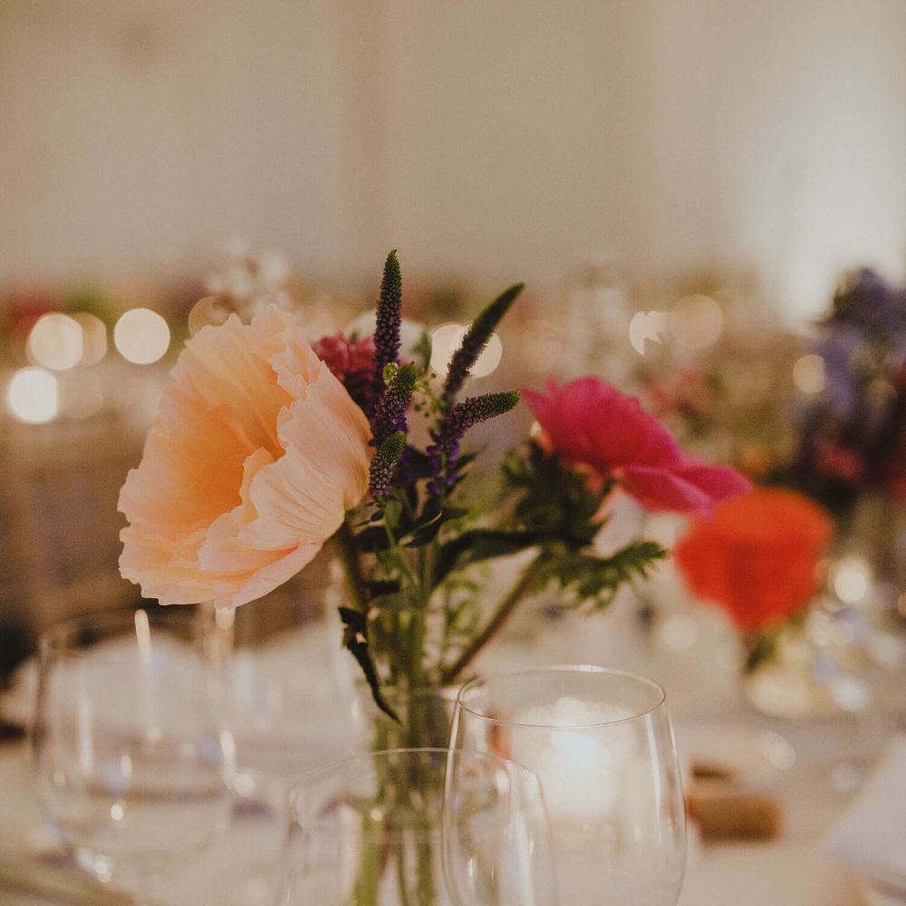 Bright peach an pink poppies for London wedding banquet 