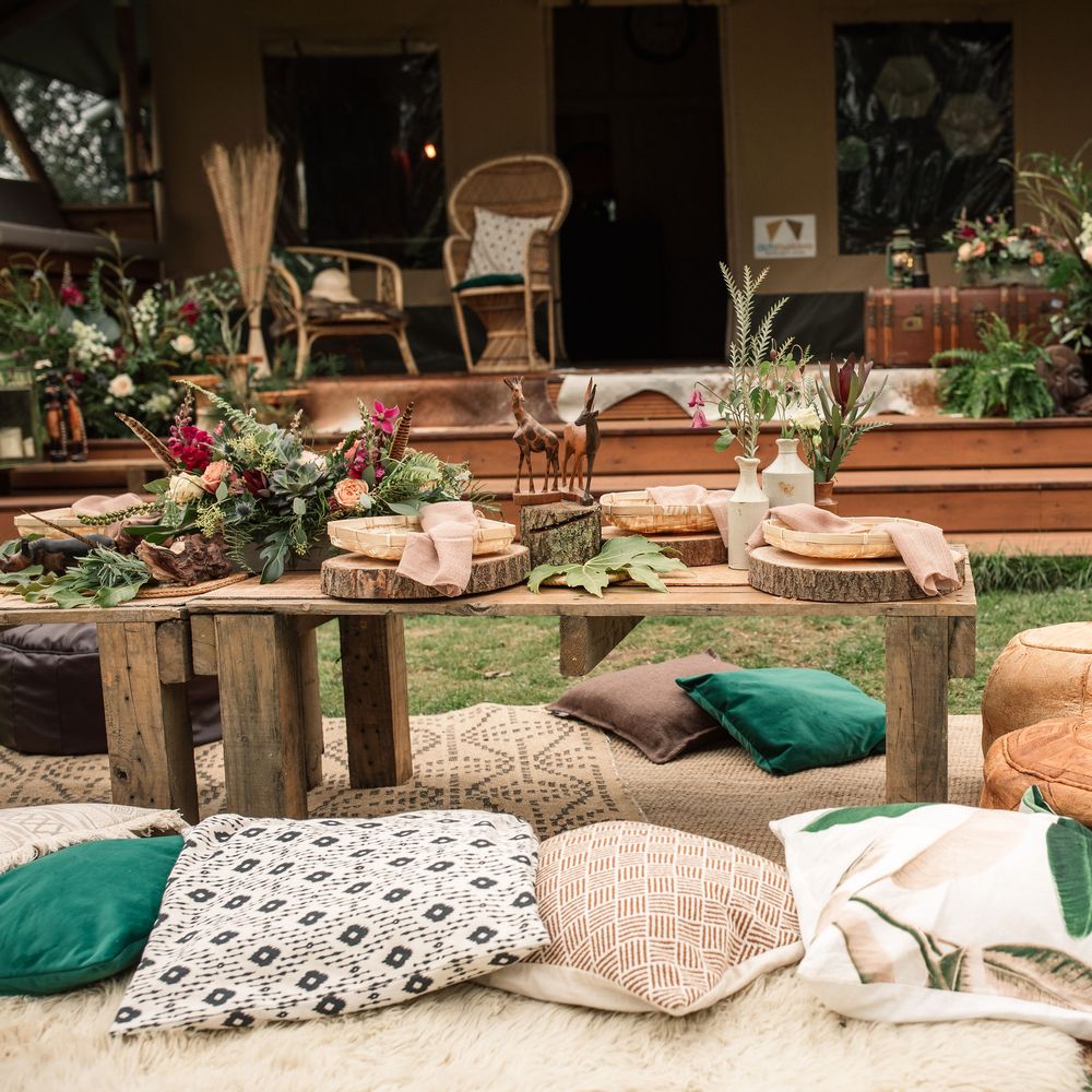 Safari inspired decor with colourful pillows and wooden table