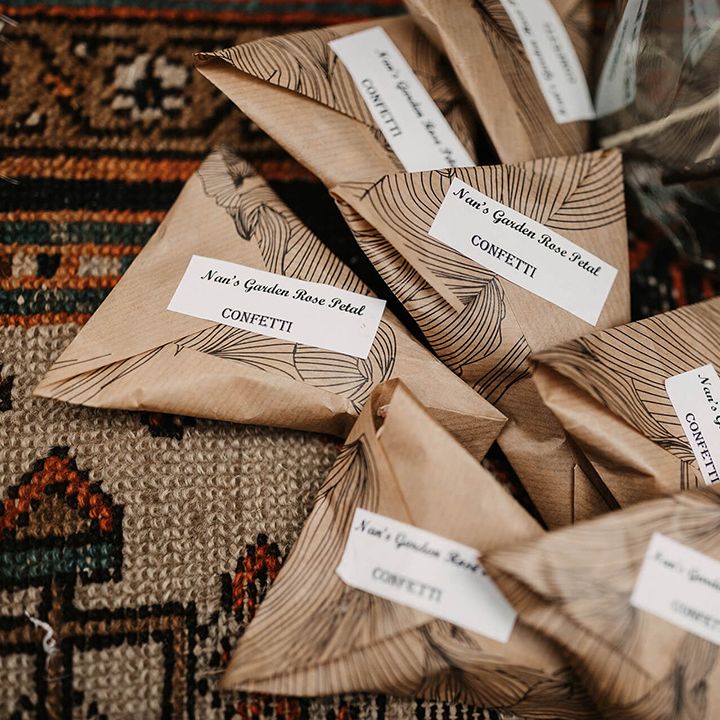 Brown paper packages filled with wedding confetti
