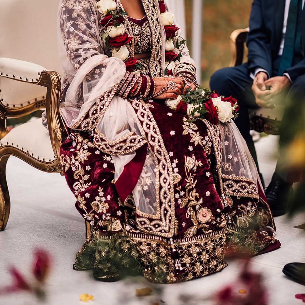 Handmade Indian saree wedding dress with gold detailing paired with incredible stunning jewels
