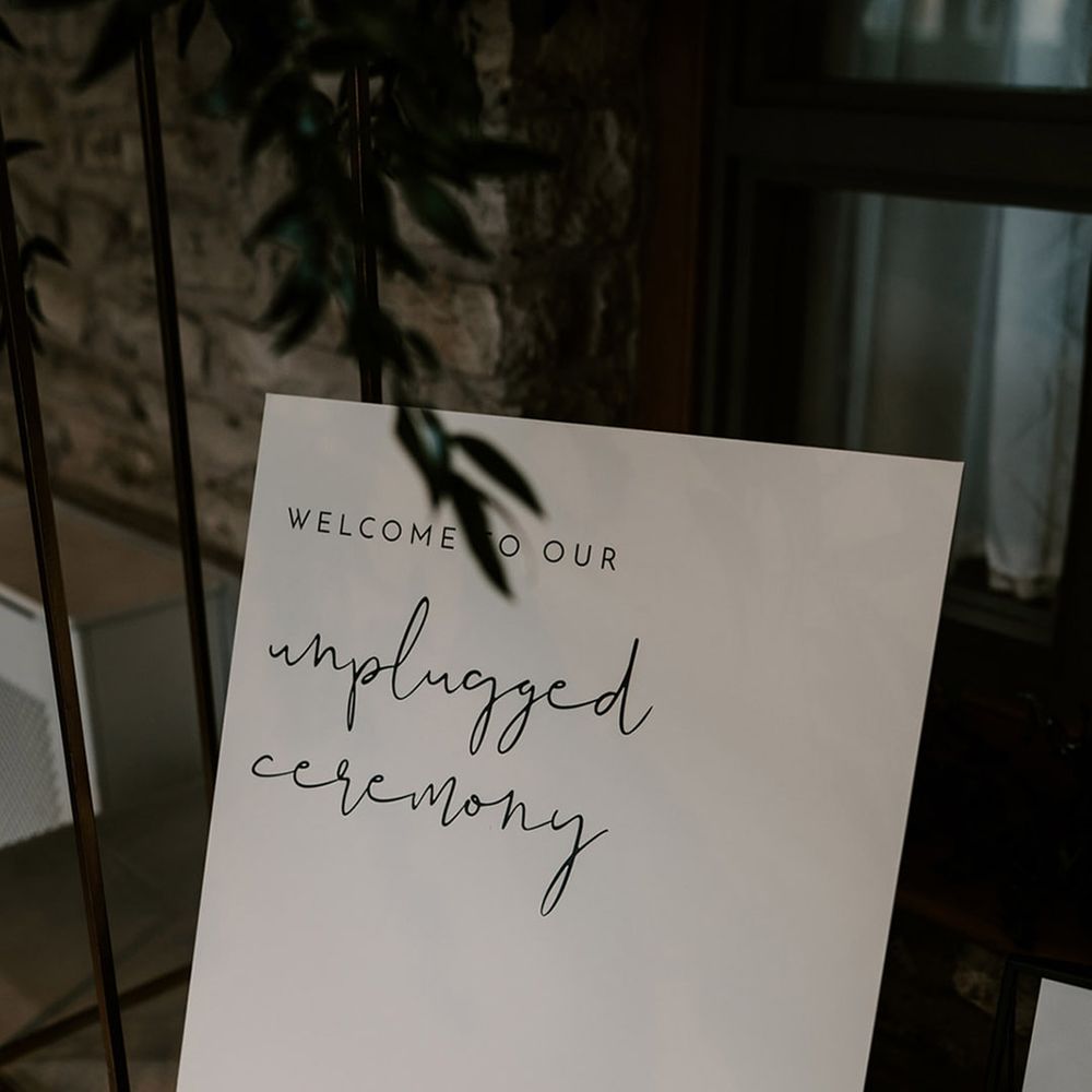 Minimal black and white unplugged wedding ceremony sign