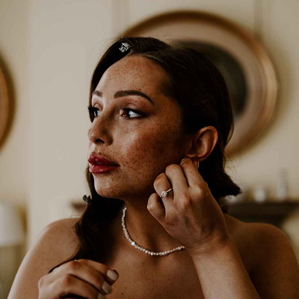 bride with freckles, dewy makeup and red lipstick