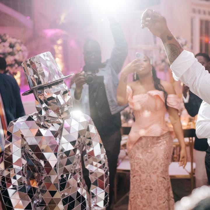 Wedding guest dancing with mirror man wedding entertainment at Syon Park vow renewal 