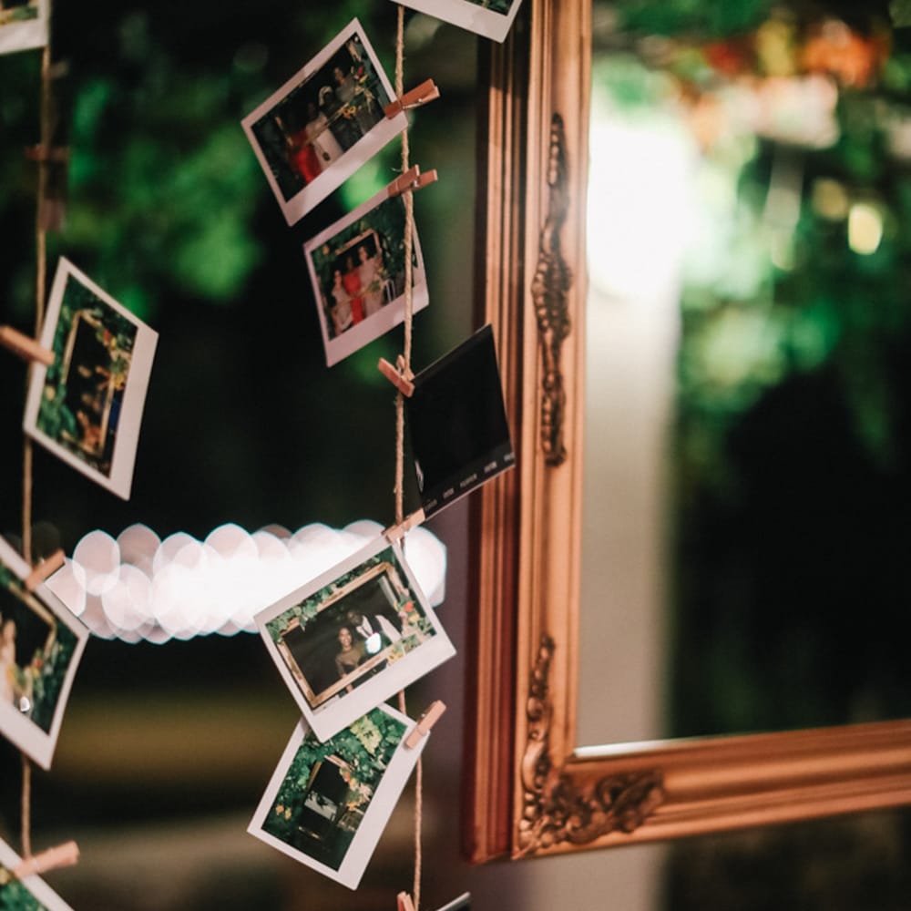 Rustic hanging photographs for stylish Italian wedding