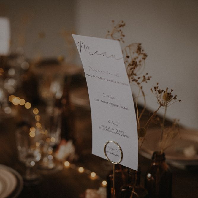 Menu card on minimalist wedding reception table 
