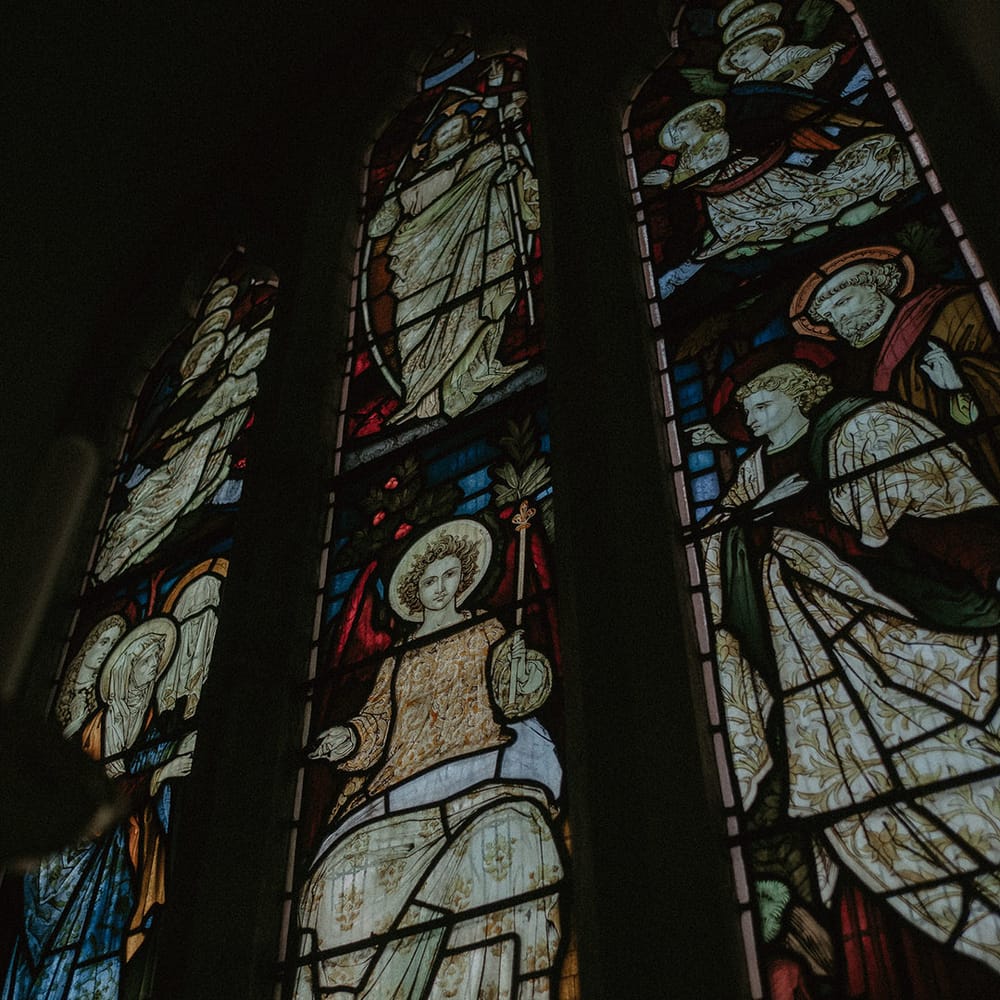 Large stain glass windows at historic and timeless Hedsor House wedding