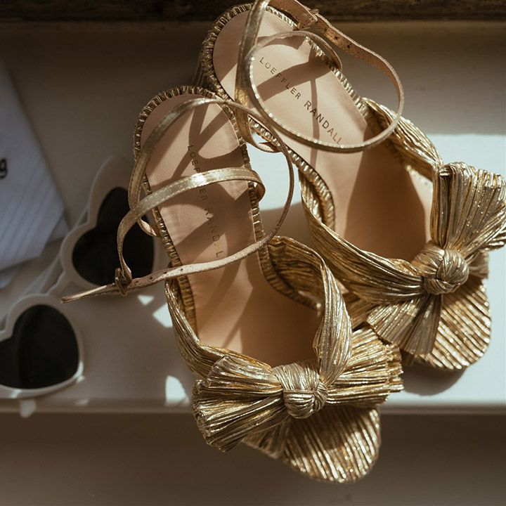Bride's gold Loeffler Randall wedding shoes with white heart retro sunglasses with embroidered handkerchief 