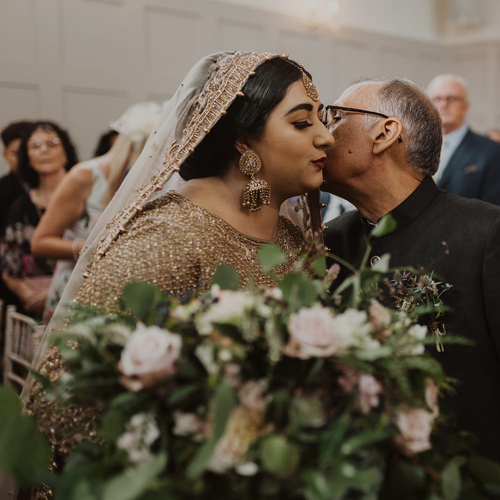 Father of the bride giving his daughter away at Nikah ceremony 