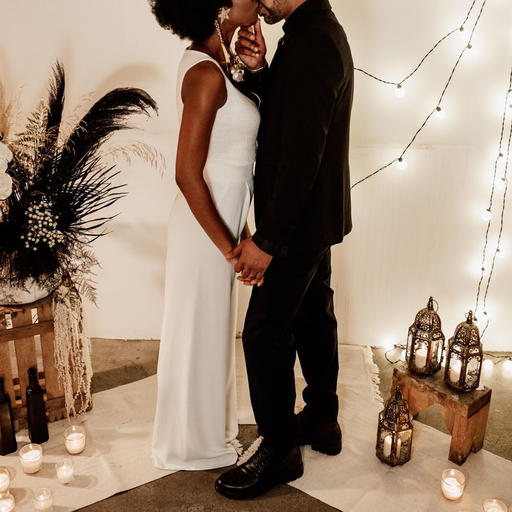 Bride & groom kiss in black and white wedding inspiration 