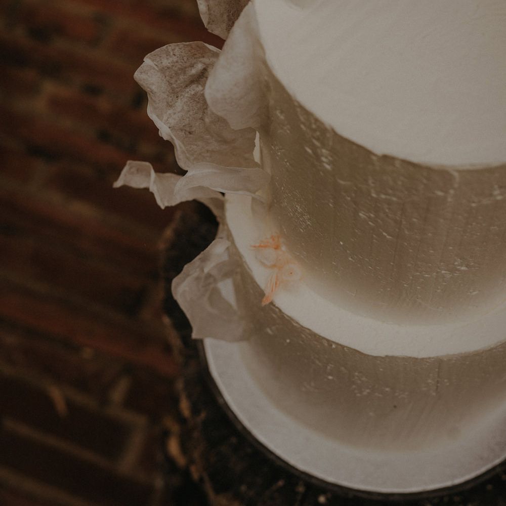 Buttercream wedding cake with ornate design 