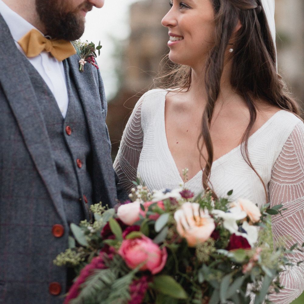 Bride and groom wedding day photography - bride wears beaded wedding gown