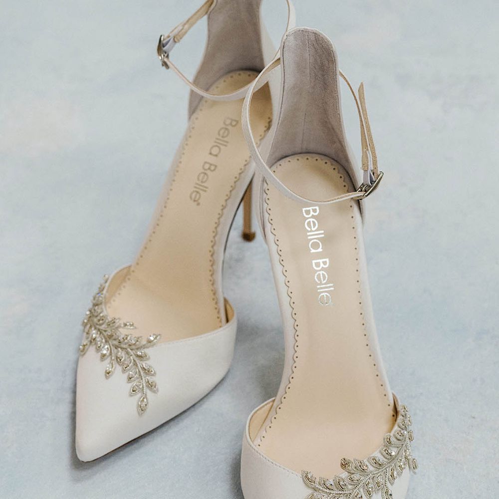 White pointed closed toe wedding shoe with crystal leaf design embellishment