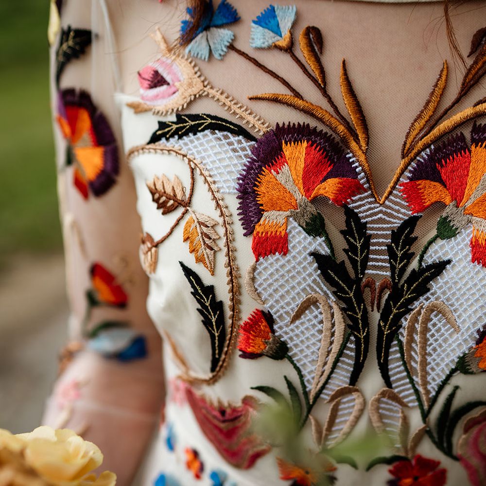 Close up of the colourful flower detail on the Temperley Bridal wedding dress