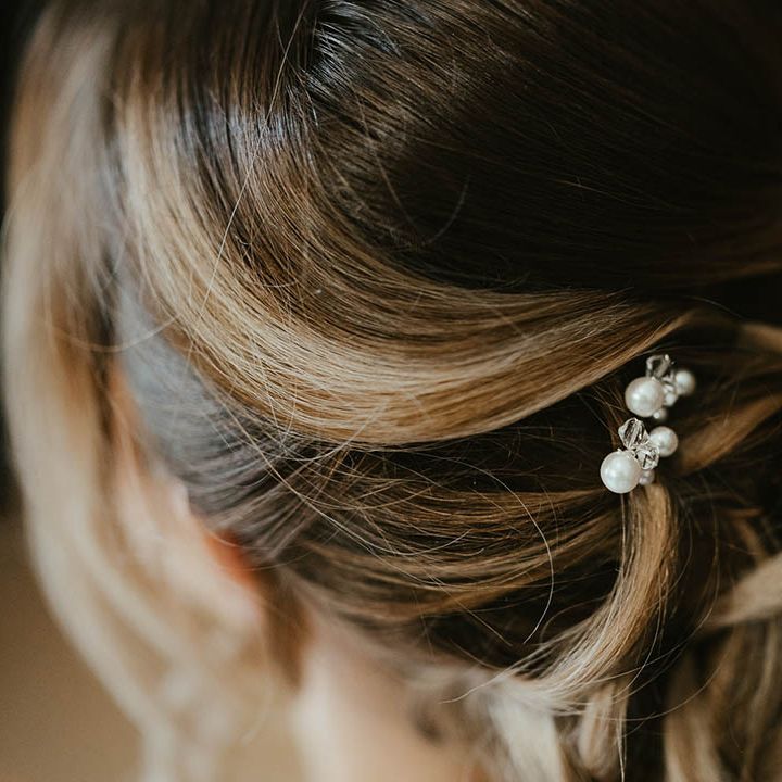 Bride with an updo with pearl hair pin accessories 
