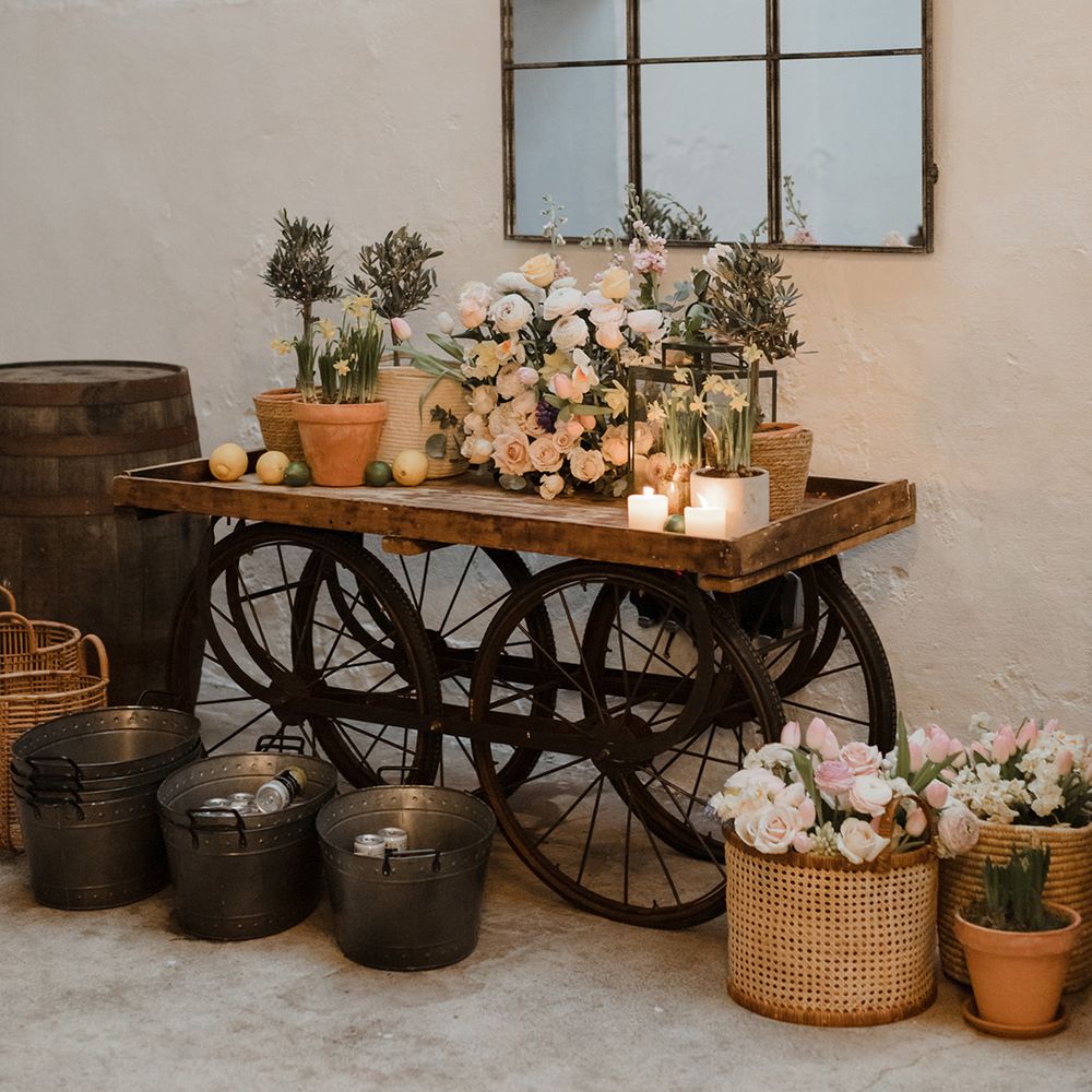 Colourful pastel wedding flowers on wooden boxes for decoration at The Cowshed Crail 