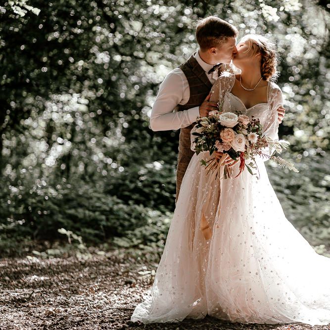 Bride and groom kissing at Sherwood Glade wedding 