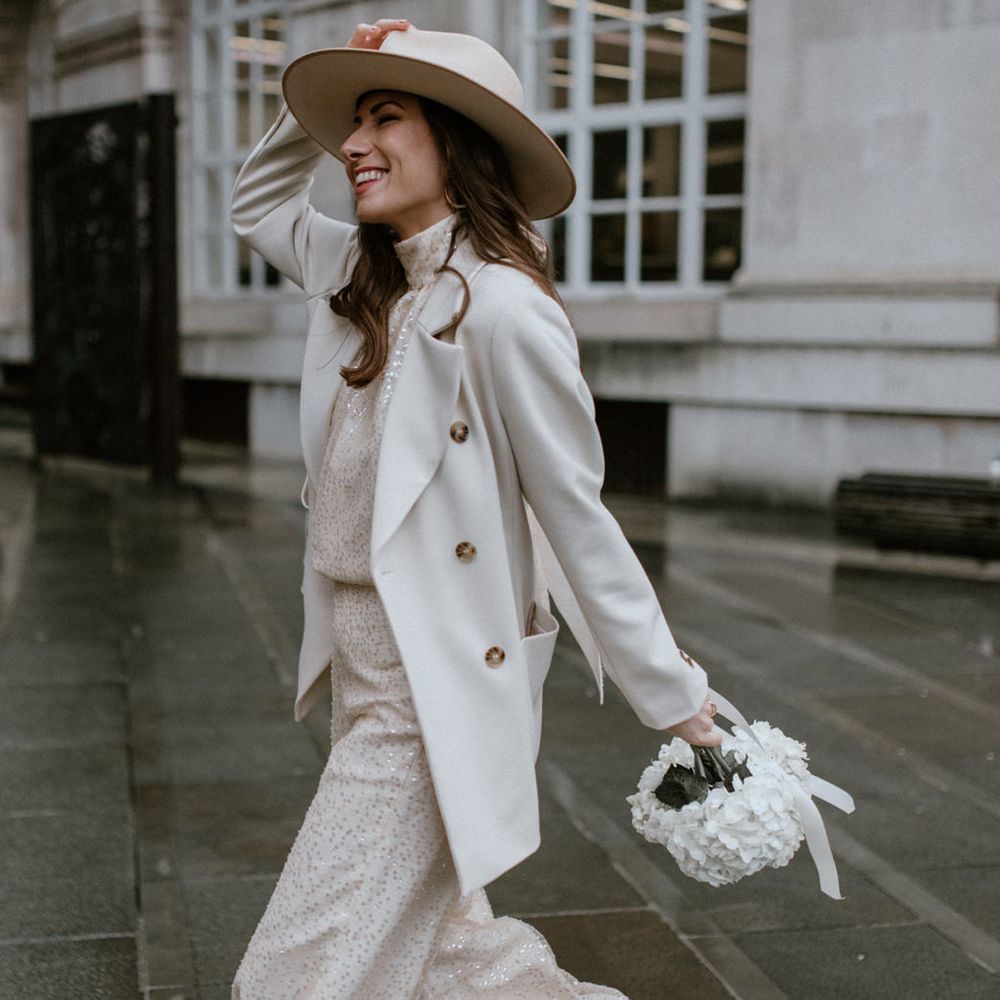 Bridal coat and hat wedding accessories for a micro wedding 