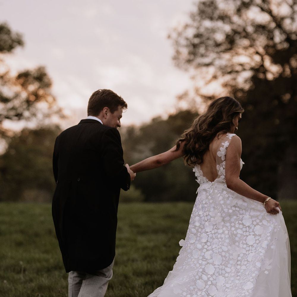 Bride in floral applique wedding dress from Mira Zwillinger 