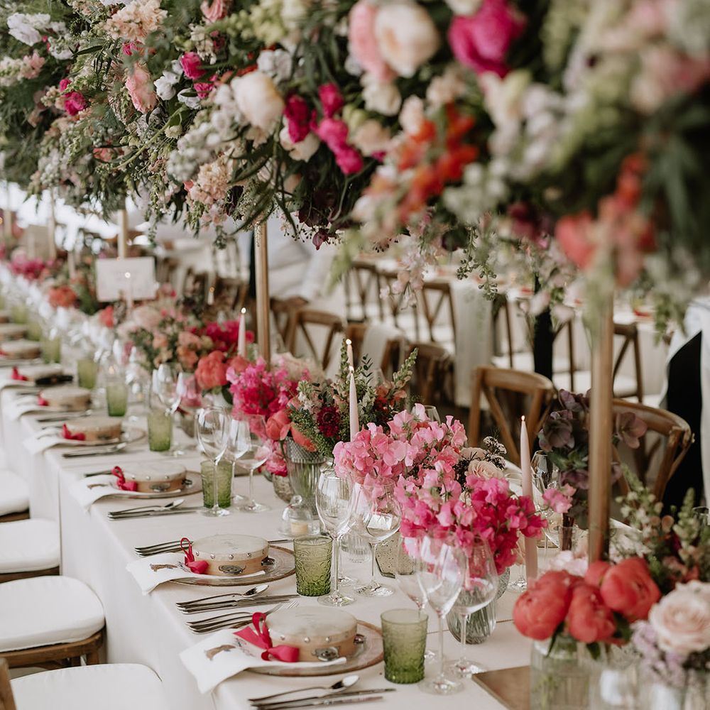 Immense pink, coral and white wedding flower display for wedding reception 