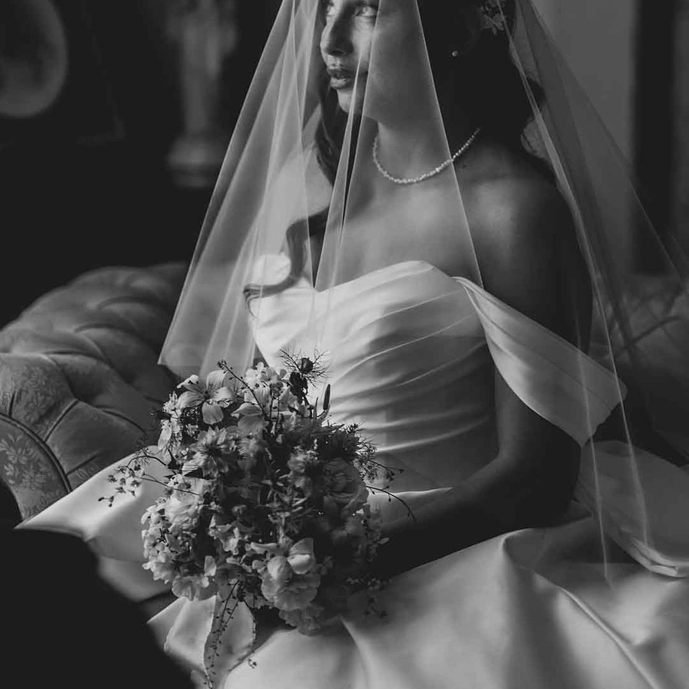 bride in a strapless wedding dress with wedding veil bridal accessory 