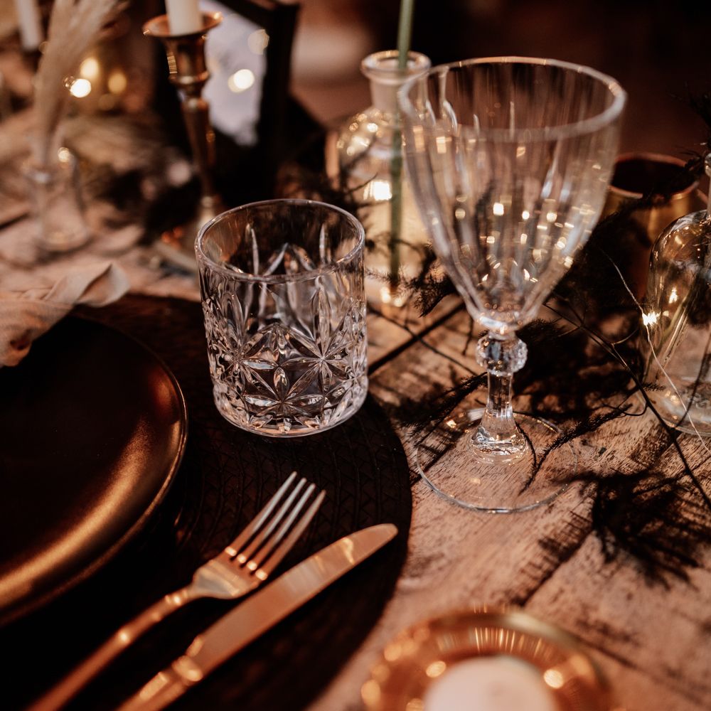Crystal tumbler on black & white table decor