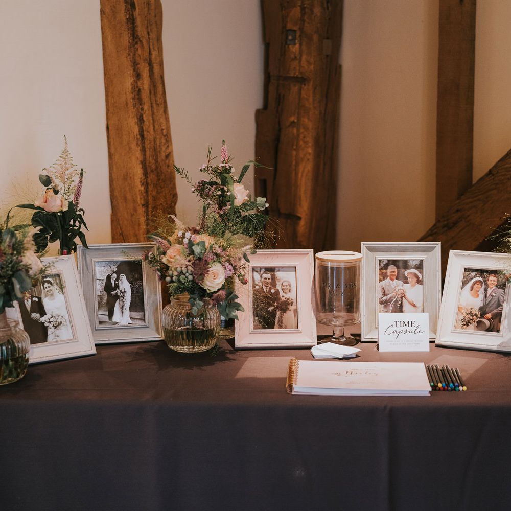 Table featuring a time capsule of relatives wedding photos