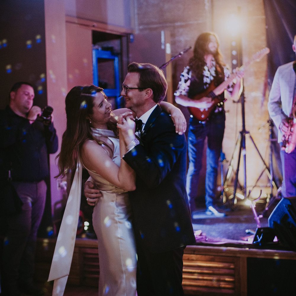 Bride & groom dance with one another on the day of their wedding during wedding reception