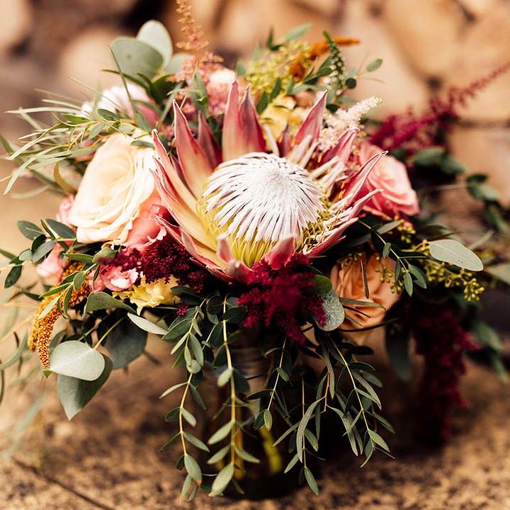 pink protea wedding bouquet 