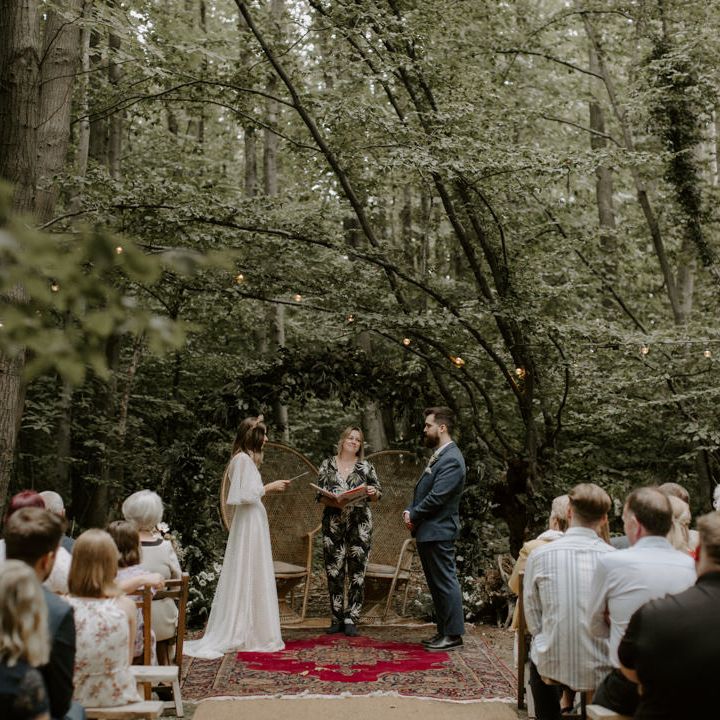 Bride & groom stand opposite one another during wedding ceremony at The Dreys