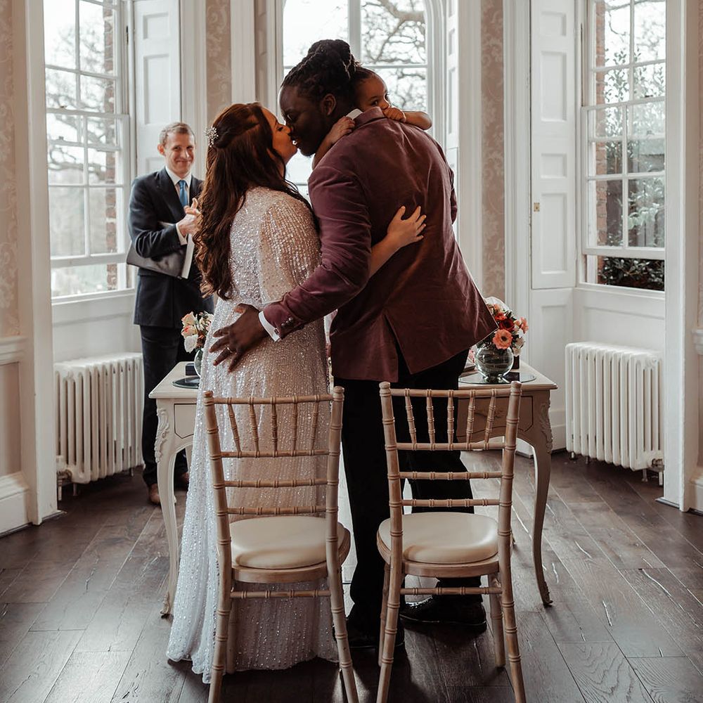 Bride & groom kiss on their wedding day