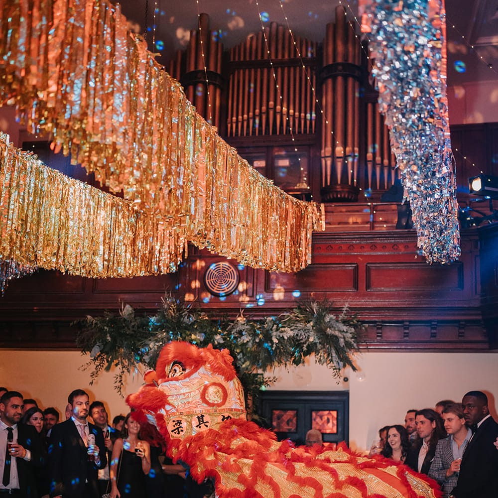 Silver and gold wedding streamers and traditional Chinese Lion Dance wedding entertainment