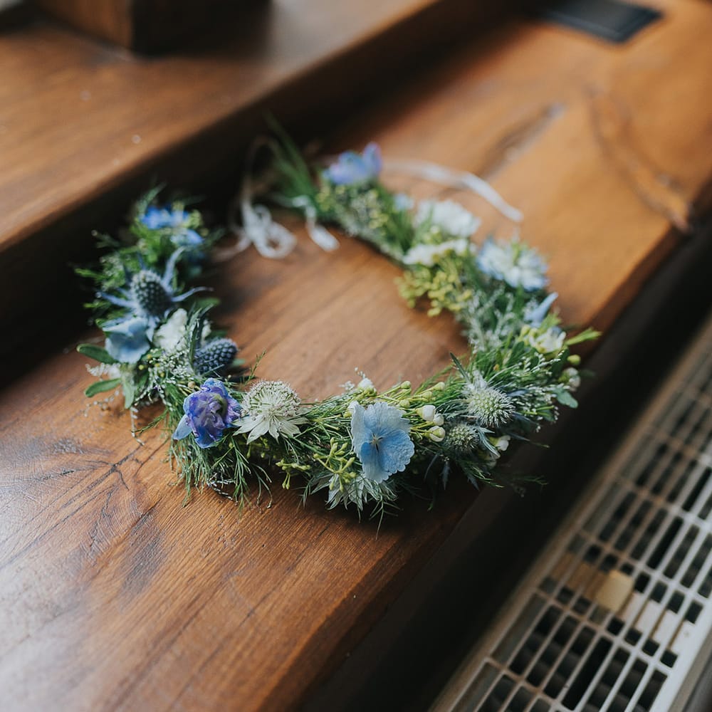 green foliage and blue flower crown 