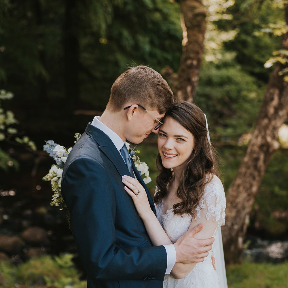 The bride and groom share an intimate embrace on their wedding day 